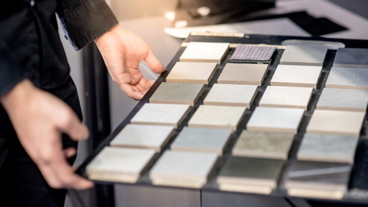 choosing ceramic sample from swatch board