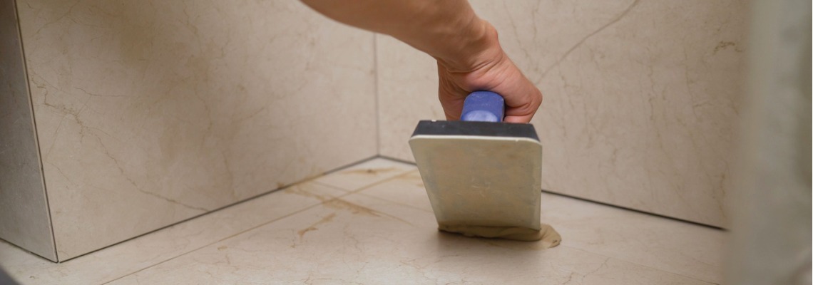 applying epoxy grout in the tiles